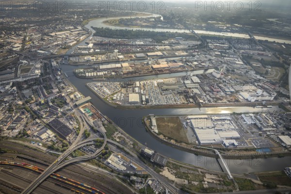 Aerial photo, harbour area, harbour facilities, Obererft, Neuss, city limits Düsseldorf, Rhineland, North Rhine-Westphalia, Germany, DE, Europe, birds-eyes view, aerial photo, aerial photography, aerial photography, overview, bird's eye view, harbour operating company, Neuss-Düsseldorfer Häfen GmbH & Co. KG, Contargo Neuss GmbH, Spedition Ansorge GmbH & Co. KG, Tanquid GmbH & Co. KG Tanklager Neuss I, Neuss customs office, Rhine, car transport, car loading, cargo ships, Neuss port, port of Neuss, port of Neuss, Rhine port, inland port, port facility, inland shipping