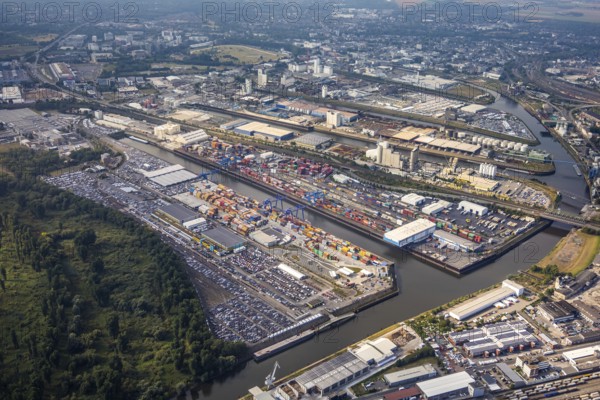 Aerial photo, harbour area, harbour facilities, Obererft, Neuss, city limits Düsseldorf, Rhineland, North Rhine-Westphalia, Germany, DE, Europe, birds-eyes view, aerial photo, aerial photography, aerial photography, overview, bird's eye view, harbour operating company, Neuss-Düsseldorfer Häfen GmbH & Co. KG, Contargo Neuss GmbH, Spedition Ansorge GmbH & Co. KG, Tanquid GmbH & Co. KG Tanklager Neuss I, Neuss customs office, Rhine, car transport, car loading, cargo ships, Neuss port, port of Neuss, port of Neuss, Rhine port, inland port, port facility, inland shipping