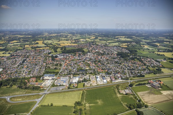 Aerial view, view of the town, Gildestraße industrial estate, Schwesternbusch woodland, St Dionysius Catholic Church, St Francis House, Cardinal von Galen Comprehensive School, Nordwalde, Münsterland, North Rhine-Westphalia, Germany. Franziskus-Haus, Kardinal von Galen Comprehensive School, Nordwalde, Münsterland, North Rhine-Westphalia, Germany, retirement home, retirement home for religious, retirement home, retirement home, place of worship, care and nursing, education, educational institution, DE, energy, Europe, distant view, comprehensive school, commercial enterprises, commercial area, commercial park, commercial location, commercial use, religious community, place of worship, industrial area, industrial site, church, parish, denomination, educational institute, aerial view, aerial photography, aerial photography, care facility, religion, school, retirement home, retirement residence, retirement home, retirement centre, townscape, urban area, overview, bird's-eye view, wind turb...