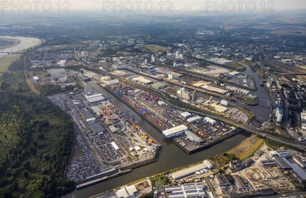 Aerial photo, harbour area, harbour facilities, Obererft, Neuss, city limits Düsseldorf, Rhineland, North Rhine-Westphalia, Germany, DE, Europe, birds-eyes view, aerial photo, aerial photography, aerial photography, overview, bird's eye view, harbour operating company, Neuss-Düsseldorfer Häfen GmbH & Co. KG, Contargo Neuss GmbH, Spedition Ansorge GmbH & Co. KG, Tanquid GmbH & Co. KG Tanklager Neuss I, Neuss customs office, Rhine, car transport, car loading, cargo ships, Neuss port, port of Neuss, port of Neuss, Rhine port, inland port, port facility, inland shipping