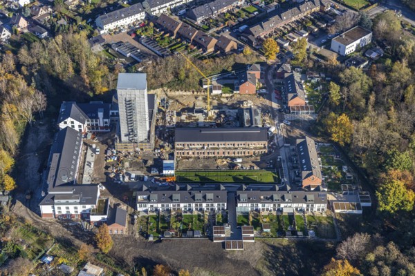 Aerial view, construction site, housing estate Am Schacht IV, Klosterhardt, Oberhausen, Ruhr area, North Rhine-Westphalia, Germany, construction work, building, construction area, building site, building plots, construction project, construction site, DE, monument protection, Europe, property tax, real estate, aerial photograph, aerial photography, aerial photography, renovation, redevelopment, tower, overview, cladding, bird's-eye view, housing estate, housing and living, residential area, residential buildings, quality of living, residential neighbourhood, housing estate, birds-eyes view, heritage-protected tower, former Osterfeld colliery, overview