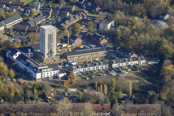 Aerial view, construction site, housing estate Am Schacht IV, Klosterhardt, Oberhausen, Ruhr area, North Rhine-Westphalia, Germany, construction work, building, construction area, building site, building plots, construction project, construction site, DE, monument protection, Europe, property tax, real estate, aerial photograph, aerial photography, aerial photography, renovation, redevelopment, tower, overview, cladding, bird's-eye view, housing estate, housing and living, residential area, residential buildings, quality of living, residential neighbourhood, housing estate, birds-eyes view, heritage-protected tower, former Osterfeld colliery, overview