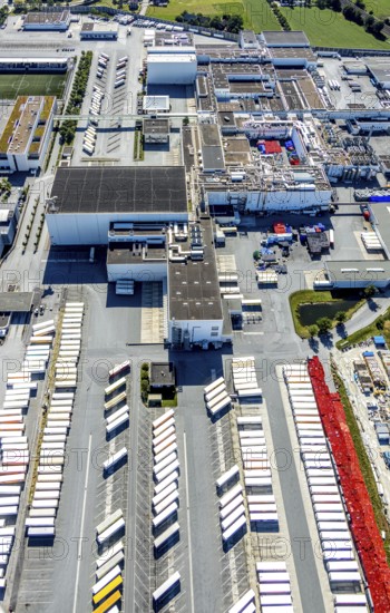 Aerial view, Corona at Tönnies, headquarters of Fleischfabrik Tönnies Lebensmittel GmbH & Co. KG, Nordrheda-Ems, Rheda-Wiedenbrück, Ostwestfalen, North Rhine-Westphalia, Germany, DE, Europe, birds-eyes view, aerial view, aerial photography, aerial photography, overview, bird's eye view, corona outbreak at Tönnies meat factory, air cooling, cutting plant, slaughterhouse, lock-down, corona pandemic, pandemic, don't call it Schnitzel, Tillmans, Tillman's, lorry trailer, refrigerated trailer, company closure