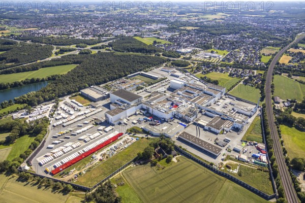 Aerial view, Corona at Tönnies, headquarters of Fleischfabrik Tönnies Lebensmittel GmbH & Co. KG, Nordrheda-Ems, Rheda-Wiedenbrück, Ostwestfalen, North Rhine-Westphalia, Germany, DE, Europe, birds-eyes view, aerial view, aerial photography, aerial photography, overview, bird's eye view, corona outbreak at Tönnies meat factory, air cooling, cutting plant, slaughterhouse, lock-down, corona pandemic, pandemic, don't call it Schnitzel, Tillmans, Tillman's, lorry trailer, refrigerated trailer, company closure