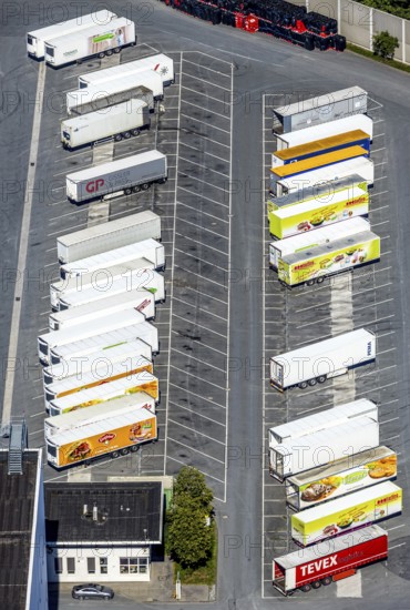 Aerial view, Corona at Tönnies, headquarters of Fleischfabrik Tönnies Lebensmittel GmbH & Co. KG, Nordrheda-Ems, Rheda-Wiedenbrück, Ostwestfalen, North Rhine-Westphalia, Germany, DE, Europe, birds-eyes view, aerial view, aerial photography, aerial photography, overview, bird's eye view, corona outbreak at Tönnies meat factory, air cooling, cutting plant, slaughterhouse, lock-down, corona pandemic, pandemic, don't call it Schnitzel, Tillmans, Tillman's, lorry trailer, refrigerated trailer, company closure