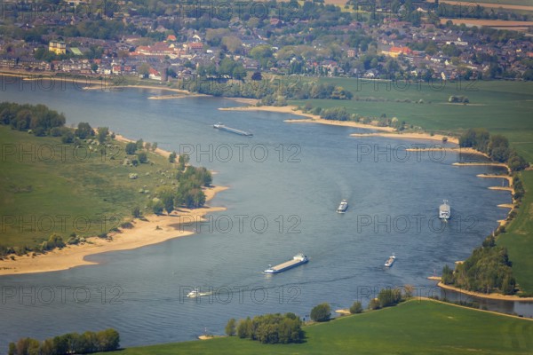 Aerial view, river Rhine, Rheinaue, Reeser Schanz landscape conservation area, shipping, cargo ships, Rees, Lower Rhine, North Rhine-Westphalia, Germany, DE, Europe, freight transport, freight traffic, landscape conservation area, logistics, aerial view, aerial photography, aerial photography, Rhine bend, shipping traffic, overview, bird's-eye view, overview