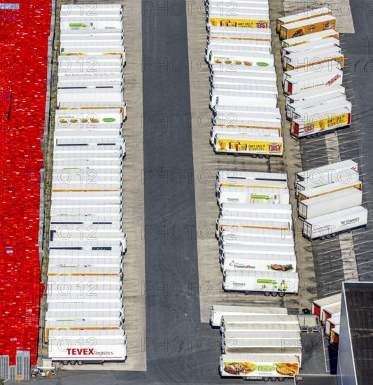 Aerial view, Corona at Tönnies, headquarters of Fleischfabrik Tönnies Lebensmittel GmbH & Co. KG, Nordrheda-Ems, Rheda-Wiedenbrück, Ostwestfalen, North Rhine-Westphalia, Germany, DE, Europe, birds-eyes view, aerial view, aerial photography, aerial photography, overview, bird's eye view, corona outbreak at Tönnies meat factory, air cooling, cutting plant, slaughterhouse, lock-down, corona pandemic, pandemic, don't call it Schnitzel, Tillmans, Tillman's, lorry trailer, refrigerated trailer, company closure