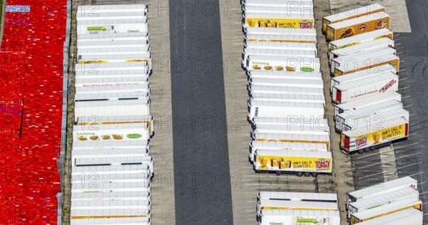 Aerial view, Corona at Tönnies, headquarters of Fleischfabrik Tönnies Lebensmittel GmbH & Co. KG, Nordrheda-Ems, Rheda-Wiedenbrück, Ostwestfalen, North Rhine-Westphalia, Germany, DE, Europe, birds-eyes view, aerial view, aerial photography, aerial photography, overview, bird's eye view, corona outbreak at Tönnies meat factory, air cooling, cutting plant, slaughterhouse, lock-down, corona pandemic, pandemic, don't call it Schnitzel, Tillmans, Tillman's, lorry trailer, refrigerated trailer, company closure