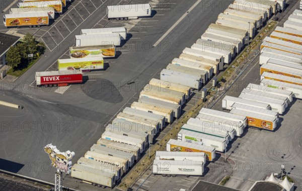 Aerial view, Corona at Tönnies, headquarters of Fleischfabrik Tönnies Lebensmittel GmbH & Co. KG, Nordrheda-Ems, Rheda-Wiedenbrück, Ostwestfalen, North Rhine-Westphalia, Germany, DE, Europe, birds-eyes view, aerial view, aerial photography, aerial photography, overview, bird's eye view, corona outbreak at Tönnies meat factory, air cooling, cutting plant, slaughterhouse, lock-down, corona pandemic, pandemic, don't call it Schnitzel, Tillmans, Tillman's, lorry trailer, refrigerated trailer, company closure