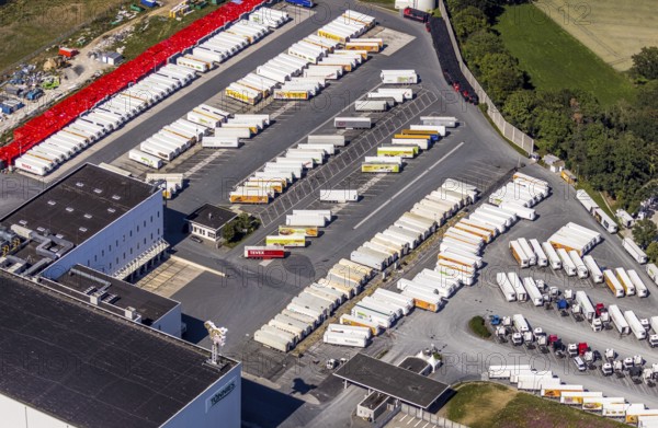 Aerial view, Corona at Tönnies, headquarters of Fleischfabrik Tönnies Lebensmittel GmbH & Co. KG, Nordrheda-Ems, Rheda-Wiedenbrück, Ostwestfalen, North Rhine-Westphalia, Germany, DE, Europe, birds-eyes view, aerial view, aerial photography, aerial photography, overview, bird's eye view, corona outbreak at Tönnies meat factory, air cooling, cutting plant, slaughterhouse, lock-down, corona pandemic, pandemic, don't call it Schnitzel, Tillmans, Tillman's, lorry trailer, refrigerated trailer, company closure