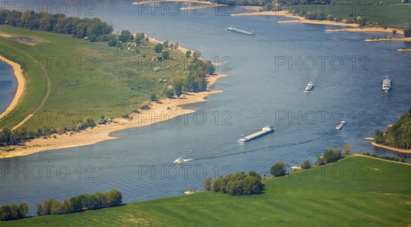 Aerial view, river Rhine, Rheinaue, Reeser Schanz landscape conservation area, shipping, cargo ships, Rees, Lower Rhine, North Rhine-Westphalia, Germany, DE, Europe, freight transport, freight traffic, landscape conservation area, logistics, aerial view, aerial photography, aerial photography, Rhine bend, shipping traffic, overview, bird's-eye view, overview