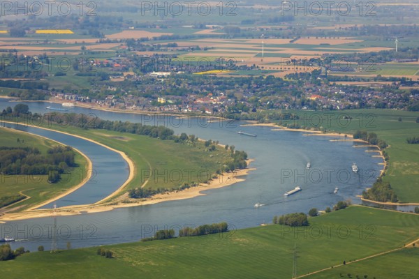 Aerial view, river Rhine, Rheinaue, Reeser Schanz landscape conservation area, shipping, cargo ships, Rees, Lower Rhine, North Rhine-Westphalia, Germany, DE, Europe, freight transport, freight traffic, landscape conservation area, logistics, aerial view, aerial photography, aerial photography, Rhine bend, shipping traffic, overview, bird's-eye view, overview