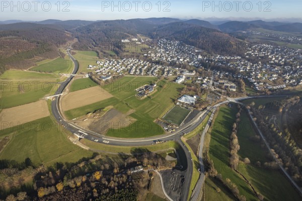 Aerial view, new construction of the bypass road L776n Bad Fredeburg, SauerlandBad, sports field, senior citizens' centre St.Raphael, Fredeburg, Schmallenberg, Sauerland, North Rhine-Westphalia, Germany, retirement home, old people's home, retirement home, bathing establishment, bathing resort, construction work, construction, construction area, building site, building plots, construction project, construction site, care and nursing, bridge, DE, relief of the through road, Europe, leisure activities, property tax, indoor swimming pool, real estate, state road L776n, aerial view, aerial photography, aerial photography, new construction, bypass, care facility, swimming pool, retirement home, retirement residence, retirement home, retirement centre, Stoppelhof, overview, bypass, bird's eye view, forest area, residential area, living and living, residential area, residential buildings, quality of life, birds-eyes view, overview