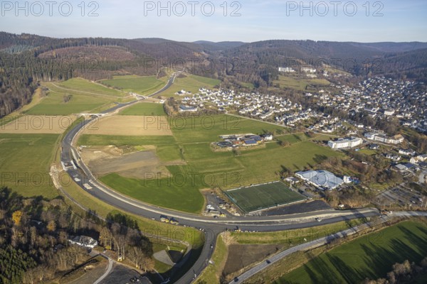Aerial view, new construction of the bypass road L776n Bad Fredeburg, SauerlandBad, sports field, senior citizens' centre St.Raphael, Fredeburg, Schmallenberg, Sauerland, North Rhine-Westphalia, Germany, retirement home, old people's home, retirement home, bathing establishment, bathing resort, construction work, construction, construction area, building site, building plots, construction project, construction site, care and nursing, bridge, DE, relief of the through road, Europe, leisure activities, property tax, indoor swimming pool, real estate, state road L776n, aerial view, aerial photography, aerial photography, new construction, bypass, care facility, swimming pool, retirement home, retirement residence, retirement home, retirement centre, Stoppelhof, overview, bypass, bird's eye view, forest area, residential area, living and living, residential area, residential buildings, quality of life, birds-eyes view, overview