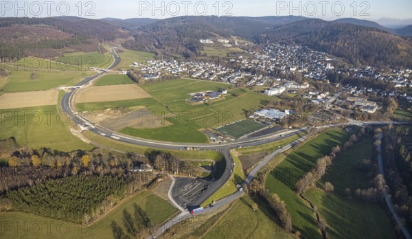 Aerial view, new construction of the bypass road L776n Bad Fredeburg, SauerlandBad, sports field, senior citizens' centre St.Raphael, Fredeburg, Schmallenberg, Sauerland, North Rhine-Westphalia, Germany, retirement home, old people's home, retirement home, bathing establishment, bathing resort, construction work, construction, construction area, building site, building plots, construction project, construction site, care and nursing, bridge, DE, relief of the through road, Europe, leisure activities, property tax, indoor swimming pool, real estate, state road L776n, aerial view, aerial photography, aerial photography, new construction, bypass, care facility, swimming pool, retirement home, retirement residence, retirement home, retirement centre, Stoppelhof, overview, bypass, bird's eye view, forest area, residential area, living and living, residential area, residential buildings, quality of life, birds-eyes view, overview