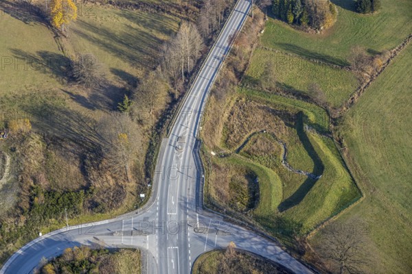 Aerial view, federal road B511 intersection Buchenweg, at the industrial park Hochsauerland, Wormbach, Schmallenberg, Sauerland, North Rhine-Westphalia, Germany, DE, Europe, shapes and colours, intersection, aerial photograph, aerial photography, aerial photography, road traffic, overview, bird's-eye view, birds-eyes view, overview