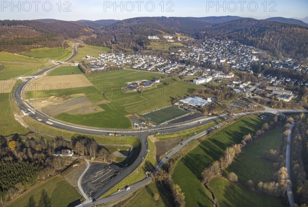 Aerial view, new construction of the bypass road L776n Bad Fredeburg, SauerlandBad, sports field, senior citizens' centre St.Raphael, Fredeburg, Schmallenberg, Sauerland, North Rhine-Westphalia, Germany, retirement home, old people's home, retirement home, bathing establishment, bathing resort, construction work, construction, construction area, building site, building plots, construction project, construction site, care and nursing, bridge, DE, relief of the through road, Europe, leisure activities, property tax, indoor swimming pool, real estate, state road L776n, aerial view, aerial photography, aerial photography, new construction, bypass, care facility, swimming pool, retirement home, retirement residence, retirement home, retirement centre, Stoppelhof, overview, bypass, bird's eye view, forest area, residential area, living and living, residential area, residential buildings, quality of life, birds-eyes view, overview