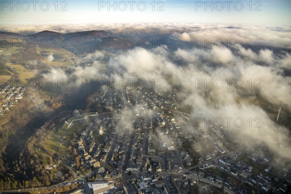 Aerial view, Winterberg centre, Catholic church looking out of the clouds, Oversum Vital Resort, Winterberg, Winterberg, Sauerland, North Rhine-Westphalia, Germany