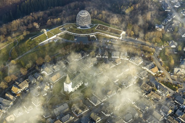 Aerial view, Winterberg centre, Catholic church looking out of the clouds, Oversum Vital Resort, Winterberg, Winterberg, Sauerland, North Rhine-Westphalia, Germany