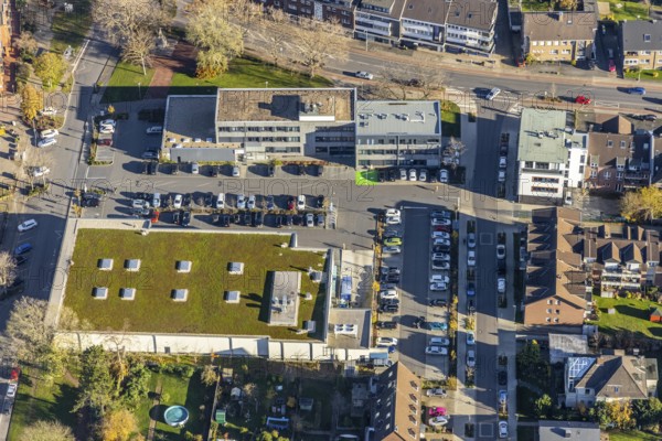 Aerial view, Edeka supermarket, Mozartstraße, Alte Rathausstraße, Andreas-Bräm-Haus, Neukirchener Erziehungsverein, Neukirchen, Neukirchen-Vluyn, Ruhr area, North Rhine-Westphalia, Germany, DE, shopping centre, shopping markets, shopping place, shopping mall, Europe, aerial view, aerial photography, aerial photography, local supply centre, shopping centre, supermarket, overview, bird's eye view, birds-eyes view, overview