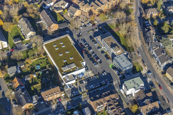 Aerial view, Edeka supermarket, Mozartstraße, Alte Rathausstraße, Andreas-Bräm-Haus, Neukirchener Erziehungsverein, Neukirchen, Neukirchen-Vluyn, Ruhr area, North Rhine-Westphalia, Germany, DE, shopping centre, shopping markets, shopping place, shopping mall, Europe, aerial view, aerial photography, aerial photography, local supply centre, shopping centre, supermarket, overview, bird's eye view, birds-eyes view, overview