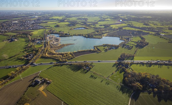 Aerial view, Krefelder Straße quarry pond, meadows and fields, Neukirchen, Neukirchen-Vluyn, Ruhr area, North Rhine-Westphalia, Germany, An der Neuen Mühle, motorway A40, Carl Risch GmbH, DE, Europe, aerial view, aerial photography, aerial photography, mill, lake, overview, bird's-eye view, overview