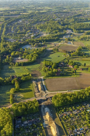 Aerial view, new bridge construction, expansion of federal road B51, new construction of federal road B481n, south-east bypass, allotment garden association Erdenglück, allotment garden association Friedland, Münster, Münsterland, North Rhine-Westphalia, Germany, construction work, construction area, construction site, construction measure, construction project, construction site, DE, Europe, community garden, KGV, canal, allotment garden, allotment garden association, aerial view, aerial photography, aerial photography, new building, allotment garden, road traffic, overview, traffic volume, bird's eye view, birds-eyes view, overview