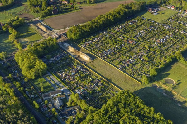 Aerial view, new bridge construction, expansion of federal road B51, new construction of federal road B481n, south-east bypass, allotment garden association Friedland, allotment garden association Erdenglück, Münster, Münsterland, North Rhine-Westphalia, Germany, construction work, construction area, construction site, construction measure, construction project, construction site, DE, Europe, community garden, KGV, canal, allotment garden, allotment garden association, aerial view, aerial photography, aerial photography, new building, allotment garden, road traffic, overview, traffic volume, bird's eye view, birds-eyes view, overview