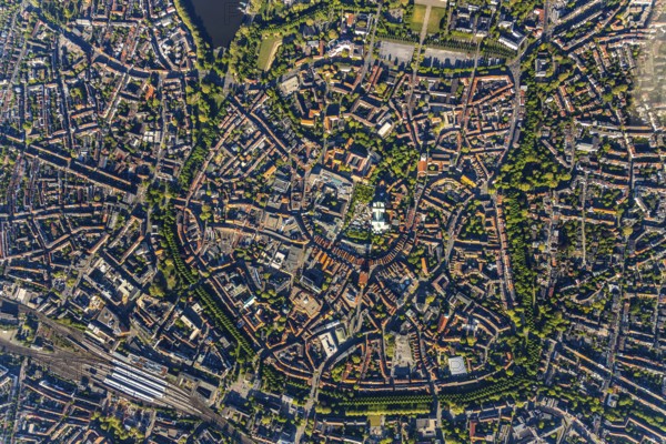 Aerial view, Old Town, Promenadenring, St Paul's Cathedral, Cathedral SquarePaulus-Dom, Domplatz, catholic Liebfrauen-Überwasserkirche, catholic St. Lamberti-Kirche, St. Martini Church, Münster Theatre, Münster Central Station, Münster, Münsterland, North Rhine-Westphalia, Germany, old town area, place of worship, railway tracks, railway station, DE, Deutsche Bahn AG, Europe, religious community, place of worship, property tax, central station, main station, real estate, church, parish, denomination, culture, art, aerial view, aerial photography, aerial photography, religion, theatre, overview, events, bird's-eye view, residential area, living and working, living and life, residential area, residential buildings, housing estate, birds-eyes view, historic city centre, historic city centre, overview