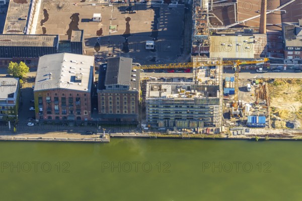 Aerial view, city harbour, construction site new office building LVM building complex, former Osmo site, Münster, Münsterland, North Rhine-Westphalia, Germany, construction work, construction area, construction site, building plots, construction project, construction site, DE, Europe, commercial enterprises, commercial area, commercial area, commercial location, commercial use, harbour, harbour basin, harbour area, harbour entrance, harbour overview, industrial facilities, industrial area, industrial location, aerial view, aerial photography, aerial photography, new construction, overview, bird's-eye view, overview