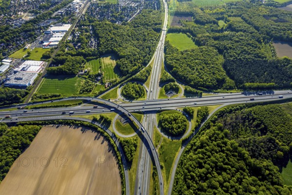 Aerial view, motorway junction Münster-Süd, motorway A1, motorway A43, Münster, Münsterland, North Rhine-Westphalia, Germany, motorway, motorway bridge, motorway junction, greening, DE, Europe, shapes and colours, freight traffic, landscape forms, aerial view, aerial photography, aerial photography, road traffic, overview, traffic, traffic volume, bird's-eye view, forest area, meadows and fields, birds-eyes view, overview