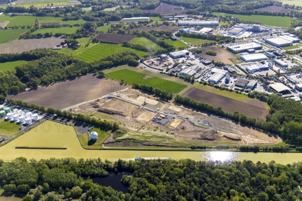 Aerial view, construction site at Westfalen Tanklager- und Transportgesellschaft, Dortmund-Ems-Kanal, industrial area Hessenweg, Münster, Münsterland, North Rhine-Westphalia, Germany, construction work, construction area, construction site, building plot, construction project, construction site, DE, Europe, commercial enterprises, commercial area, commercial area, commercial location, commercial use, industrial plants, industrial area, industrial location, aerial photograph, aerial photography, aerial photography, overview, bird's eye view, birds-eyes view, overview