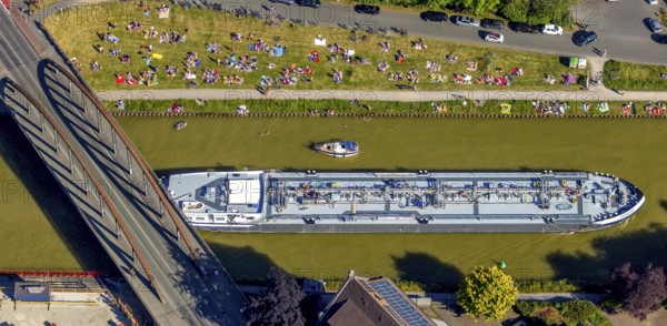 Aerial view, bathing at the canal, Dortmund-Ems canal, sunbathing lawn, sunbathing, August-Schepers-Straße, bridge Wolbecker Straße, Memelufer, Mauritz, Münster, Münsterland, North Rhine-Westphalia, Germany, bridge, DE, Europe, leisure, leisure pool, leisure activities, Klartext-Verlag, aerial view, aerial photography, aerial photography, Münster from above, Münster book, shipping traffic, summer fun, sun worshippers, lido, lido, overview, bird's eye view, birds-eyes view, free bathing establishment, overview, Corona distance. Corona distance, pandemic restrictions, end of lockdown, inland shipping, tanker, tanker cargo ship