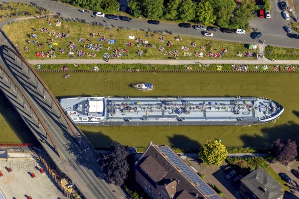 Aerial view, bathing at the canal, Dortmund-Ems canal, sunbathing lawn, sunbathing, August-Schepers-Straße, bridge Wolbecker Straße, Memelufer, Mauritz, Münster, Münsterland, North Rhine-Westphalia, Germany, bridge, DE, Europe, leisure, leisure pool, leisure activities, Klartext-Verlag, aerial view, aerial photography, aerial photography, Münster from above, Münster book, shipping traffic, summer fun, sun worshippers, lido, lido, overview, bird's eye view, birds-eyes view, free bathing establishment, overview, Corona distance. Corona distance, pandemic restrictions, end of lockdown, inland shipping, tanker, tanker cargo ship