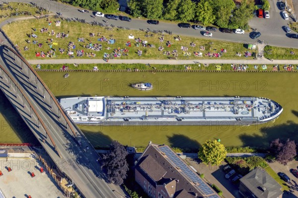 Aerial view, bathing at the canal, Dortmund-Ems canal, sunbathing lawn, sunbathing, August-Schepers-Straße, bridge Wolbecker Straße, Memelufer, Mauritz, Münster, Münsterland, North Rhine-Westphalia, Germany, bridge, DE, Europe, leisure, leisure pool, leisure activities, Klartext-Verlag, aerial view, aerial photography, aerial photography, Münster from above, Münster book, shipping traffic, summer fun, sun worshippers, lido, lido, overview, bird's eye view, birds-eyes view, free bathing establishment, overview, Corona distance. Corona distance, pandemic restrictions, end of lockdown, inland shipping, tanker, tanker cargo ship