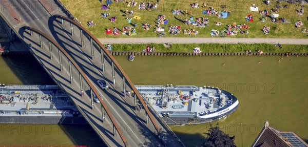 Aerial view, bathing at the canal, Dortmund-Ems canal, sunbathing lawn, sunbathing, August-Schepers-Straße, bridge Wolbecker Straße, Memelufer, Mauritz, Münster, Münsterland, North Rhine-Westphalia, Germany, bridge, DE, Europe, leisure, leisure pool, leisure activities, Klartext-Verlag, aerial view, aerial photography, aerial photography, Münster from above, Münster book, shipping traffic, summer fun, sun worshippers, lido, lido, overview, bird's eye view, birds-eyes view, free bathing establishment, overview, Corona distance. Corona distance, pandemic restrictions, end of lockdown, inland shipping, tanker, tanker cargo ship