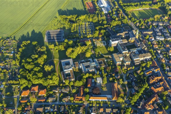 Aerial view, Rehabilitation centre at St. Josef-Stift, St. Josef-Stift Sendenhorst clinic for rheumatology, chapel & historical part of St. Josef-Stift, cath. Primary school, Kindergarten Sankt Michael, Sendenhorst, Warendorf district, Münsterland, North Rhine-Westphalia, Germany, place of worship, DE, Europe, football pitch, football stadium, football club, healthcare, religious community, place of worship, hospital, kindergarten, day nursery, crèche, day care centre, church, parish, day nursery, clinic, clinic centre, denomination, hospital, aerial view, aerial photography, aerial photography, medical facility, medical aid, emergency service, religion, sport, sports facilities, sports field, sports facility, tennis, overview, bird's-eye view, Westtor sports field, birds-eyes view, overview, medical care