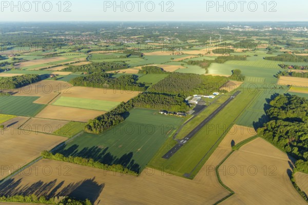 Aerial photo, Münster-Telgte airfield, Telgte, Warendorf district, Münsterland, North Rhine-Westphalia, Germany, DE, Europe, distant view, airport, FunFlight flight school, runway, aerial photo, aerial photography, aerial photography, runway, overview, bird's-eye view, woodland, meadows and fields, birds-eyes view, overview