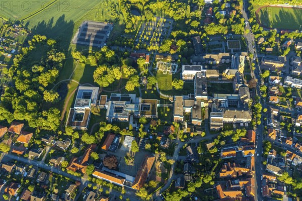 Aerial view, Rehabilitation Centre at St. Josef-Stift, St. Josef-Stift Sendenhorst Clinic for Rheumatology, Chapel & historical part of St. Josef-Stift, cath. Primary school, St. Michael's Kindergarten, Sendenhorst, Warendorf district, Münsterland, North Rhine-Westphalia, Germany, place of worship, DE, Europe, healthcare, religious community, place of worship, hospital, kindergarten, day nursery, crèche, day care centre, church, parish, day nursery, clinic, clinic centre, denomination, hospital, aerial view, aerial photography, aerial photography, medical facility, medical aid, emergency service, religion, overview, bird's-eye view, Westtor sports field, birds-eyes view, overview, medical care