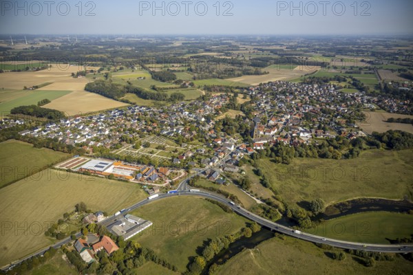 Aerial view, river Lippe, Lippe meadows, nature reserve, bridge Heintroper Straße over the Lippe, view of Lippborg, Lippetal, district Soest, North Rhine-Westphalia, Germany, place of worship, federal road B475, DE, Europe, religious community, place of worship, main street, church, parish, denomination, Kreis-Soest-Buch, KreisSoestBuch, aerial photography, aerial photography, NSG, nature conservation, religion, overview, environmental protection, bird's-eye view, meadows and fields, meadows and pastures, birds-eyes view, catholic church of St. Cornelius and St. Cyprelius, church of St. Cyprelius and St. Cyprelius Church of St Cornelius and Cyprian, national nature reserve, overview