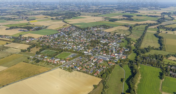 Aerial view, view of the town, St. Stephanus Kirche, Oestinghausen, Lippetal, Kreis Soest, North Rhine-Westphalia, Germany, Aldi Supermarkt Neubau, Andachtstätte, DE, Europa, Fußballplatz, Fußballstadion, Fußballverein, Glaubensgemeinschaft, Gotteshaus, Grundsteuer, Immobilien, Kirche, Kirchengemeinde, Konfession, Kreis-Soest-Buch, KreisSoestBuch, aerial view, aerial photography, aerial photography, religion, sports, sports facilities, sports field, sports facility, stadium, townscape, urban area, overview, bird's-eye view, meadows and fields, residential area, housing and living, residential area, residential buildings, residential quality, residential neighbourhood, housing estate, birds-eyes view, overview