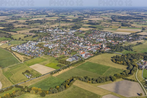 Aerial view, local view Niederbauer, catholic church pilgrimage basilica St. Ida, Lippetal, district of Soest, North Rhine-Westphalia, Germany, place of worship, education, educational institution, DE, Europe, distant view, football pitch, religious community, place of worship, property tax, real estate, church, church square, denomination, district of Soest-Buch, district of Soest-Buch, educational institute, Lippetal school, Lippstädter Straße, aerial view, aerial photography, aerial photography, rectory, parish church, religion, school, sports ground, overview, bird's-eye view, meadows and fields, housing estate, housing and living, residential area, residential buildings, housing quality, residential neighbourhood, housing estate, birds-eyes view, overview