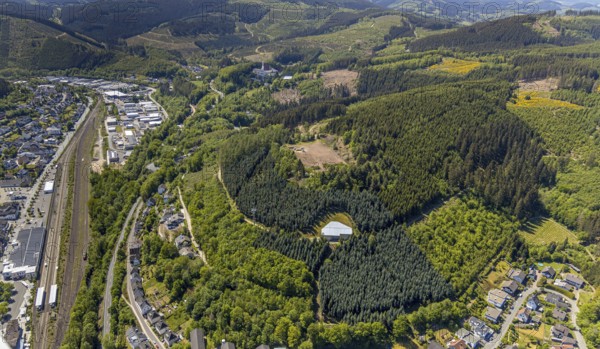 Aerial view, Lennestadt-Altenhundem railway station, construction site in the forest sports field GymSL, Altenhundem, Lennestadt, Sauerland, North Rhine-Westphalia, Germany, DE, Europe, hilly landscape, aerial view, aerial photography, aerial photography, sports field, sports facility, overview, under the cliffs, bird's eye view, forest area, birds-eyes view, overview