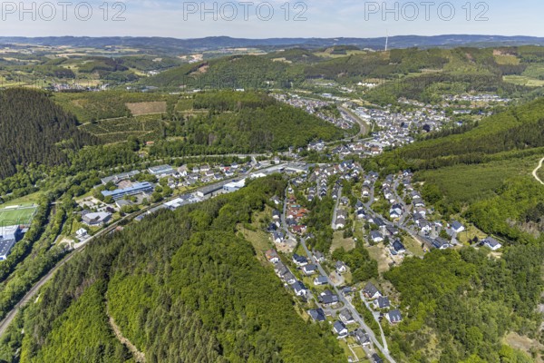Aerial view, residential area Faulebutter Siepen, secondary school Hundem-Lenne, St. Barbara-Schule Meggen, theatre of the city of Lennestadt, Anne-Frank-Platz, Lennestadt, Sauerland, North Rhine-Westphalia, Germany, railway tracks, DE, Europe, distant view, property tax, hilly landscape, real estate, aerial view, aerial photography, aerial photography, overview, bird's-eye view, forest, living and life, residential area, residential buildings, quality of life, bird's-eye view, overview