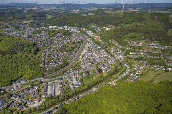 Aerial view, view of Meggen, Lennestadt-Meggen railway station, Rayonex Biomedical GmbH, Franziskus-Schule Meggen, DITIB Yesil Mosque Lennestadt, Catholic Church St. Bartholomäus, Meggen, Lennestadt, Sauerland, North Rhine-Westphalia, Germany, place of worship, railway tracks, railway station, burial site, education, educational institution, DE, Deutsche Bahn AG, Europe, distant view, cemetery, Meggen cemetery, Schützenhof restaurant, memorial, religious community, churchyard, place of worship, property tax, cemetery, hilly landscape, real estate, church, parish, denomination, educational institution, aerial view, aerial photography, aerial photography, resting place, school, overview, bird's-eye view, housing estate, living and life, residential area, residential buildings, residential quality, housing estate, birds-eyes view, overview, wladg