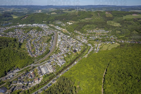 Aerial view, view of Meggen, Lennestadt-Meggen railway station, Rayonex Biomedical GmbH, Franziskus-Schule Meggen, DITIB Yesil Mosque Lennestadt, Catholic Church St. Bartholomäus, Meggen, Lennestadt, Sauerland, North Rhine-Westphalia, Germany, place of worship, railway tracks, railway station, burial site, education, educational institution, DE, Deutsche Bahn AG, Europe, distant view, cemetery, Meggen cemetery, Schützenhof restaurant, memorial, religious community, churchyard, place of worship, property tax, cemetery, hilly landscape, real estate, church, parish, denomination, educational institution, aerial view, aerial photography, aerial photography, resting place, school, overview, bird's-eye view, housing estate, living and life, residential area, residential buildings, residential quality, housing estate, birds-eyes view, overview, wladg