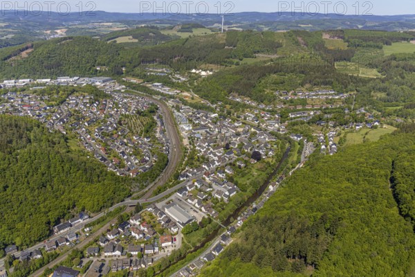 Aerial view, view of Meggen, Lennestadt-Meggen railway station, Rayonex Biomedical GmbH, Franziskus-Schule Meggen, DITIB Yesil Mosque Lennestadt, Catholic Church St. Bartholomäus, Meggen, Lennestadt, Sauerland, North Rhine-Westphalia, Germany, place of worship, railway tracks, railway station, burial site, education, educational institution, DE, Deutsche Bahn AG, Europe, distant view, cemetery, Meggen cemetery, Schützenhof restaurant, memorial, religious community, churchyard, place of worship, property tax, cemetery, hilly landscape, real estate, church, parish, denomination, educational institution, aerial view, aerial photography, aerial photography, resting place, school, overview, bird's-eye view, housing estate, living and life, residential area, residential buildings, residential quality, housing estate, birds-eyes view, overview, wladg