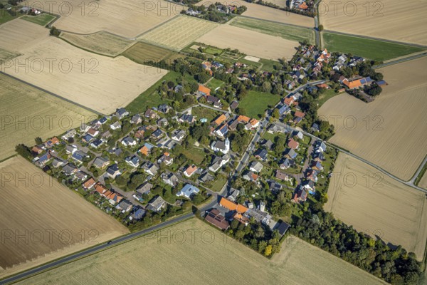 Aerial view, local view Schoneberg, catholic church St. Johannes, Bürgerhaus Schoneberg, Lippetal, Kreis Soest, North Rhine-Westphalia, Germany, place of worship, DE, Europe, religious community, place of worship, property tax, holy place, real estate, church, parish, denomination, Kreis-Soest-Buch, KreisSoestBuch, aerial view, aerial photography, aerial photography, religion, religious site, Schoneberger Straße, overview, bird's-eye view, meadows and fields, residential area, living and life, residential area, residential buildings, quality of life, residential neighbourhood, housing estate, birds-eyes view, overview