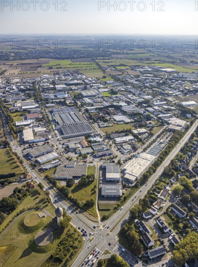 Aerial view, industrial estate Am Wasserturm, Bökenförder Straße, Lippstadt, district of Soest, North Rhine-Westphalia, Germany, Berliner Straße, federal road B55, Columna infinita, DE, monument protection, Europe, commercial enterprises, commercial area, industrial estate, commercial park, commercial location, commercial use, industrial monument, industrial area, industrial building, industrial site, Kreis-Soest-Buch, KreisSoestBuch, art object, aerial photograph, aerial photography, aerial photography, sight, overview, bird's-eye view, landmark, water tower Lippstadt, birds-eyes view, overview