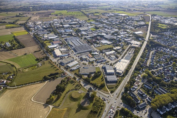 Aerial view, industrial estate Am Wasserturm, Bökenförder Straße, Lippstadt, district of Soest, North Rhine-Westphalia, Germany, Berliner Straße, federal road B55, Columna infinita, DE, monument protection, Europe, distant view, commercial enterprises, commercial area, commercial park, commercial site, commercial use, industrial monument, industrial area, industrial building, industrial site, Kreis-Soest-Buch, KreisSoestBuch, art object, aerial photograph, aerial photography, aerial photography, sight, overview, bird's-eye view, landmark, water tower Lippstadt, meadows and fields, birds-eyes view, overview